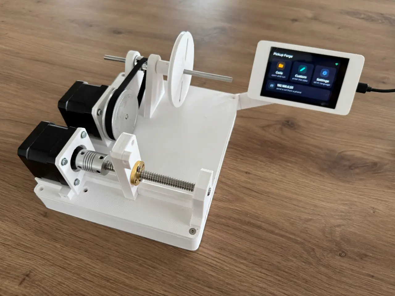 The assembled W1 prototype on the bench, wired up, with its touchscreen lit